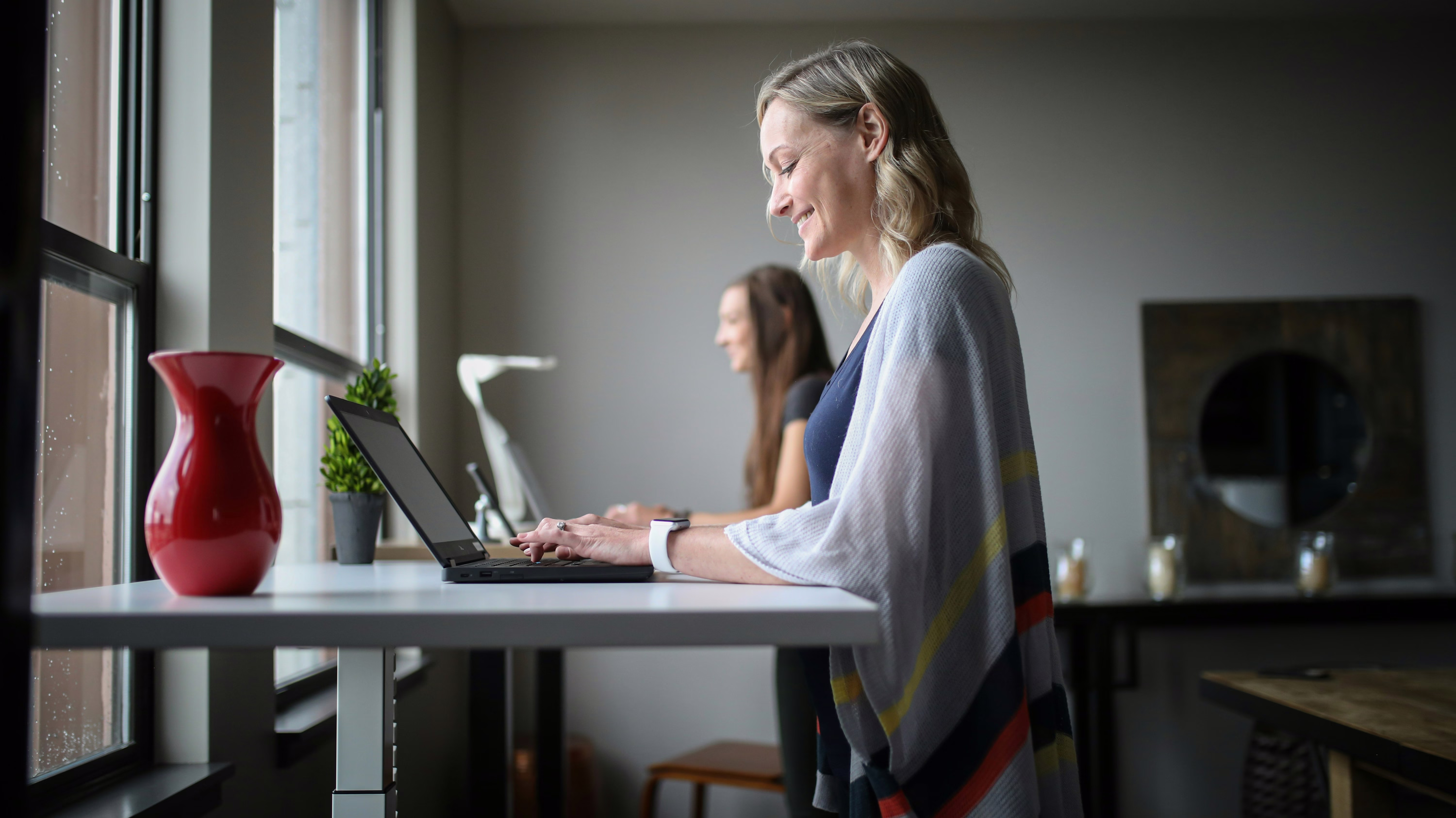 Women working on laptops in an office